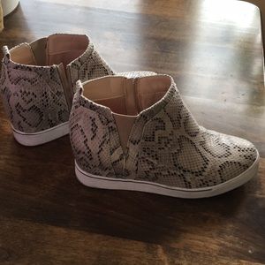 2 inch tall snake print shoe.